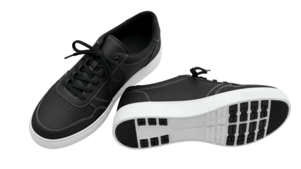 Pair of black casual athletic footwear displayed against a dark background