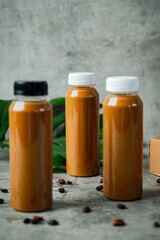 Beautiful reflection of coffee bottles under warm lighting.