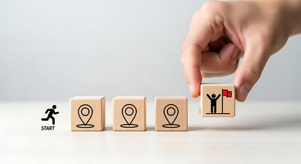 Visualizing roadmap to success, hand places final block with triumphant figure, setting goals, aiming for career growth, and achieving dream destination