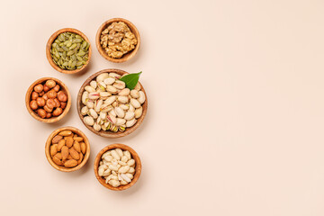 A vibrant assortment of various nuts, including almonds, walnuts, hazelnuts, cashews, and pistachios