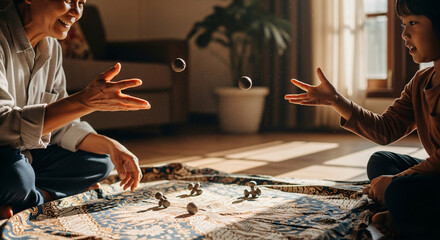 Obraz premium A grandparent and child playing five stones (traditional Southeast Asian game) in a warmly lit living room, mid-throw, with visible dust particles in the sunlight