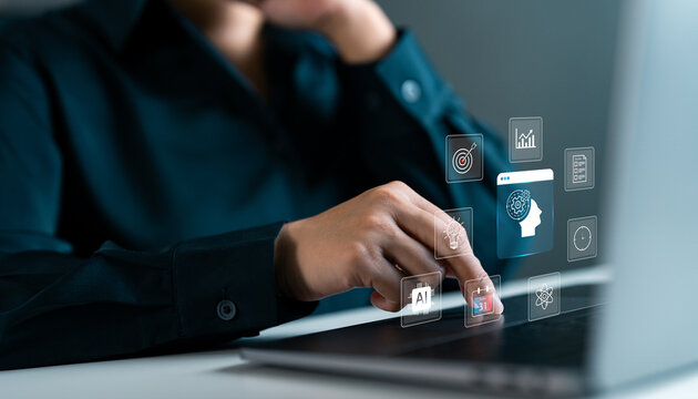 Businesswoman using AI tools on laptop for digital planning and data visualization, artificial intelligence in corporate environment for automation and efficiency. AI technology in business.