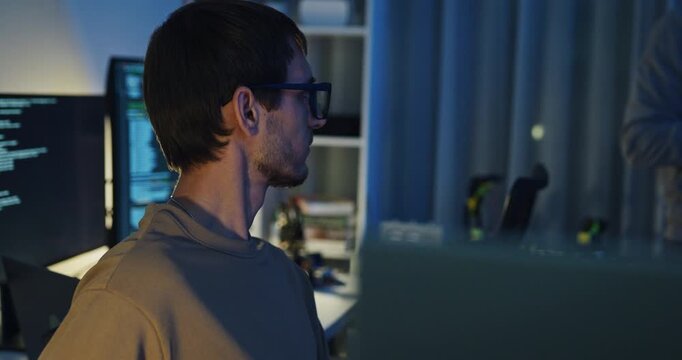 Team adult male engineer develop present AI robotics hand project at tech workspace night. Artificial intelligence, collaboration support prototype development, robotic, machine learn, training.