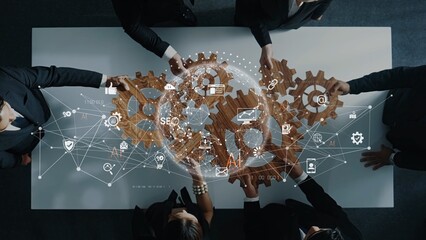 Dynamic business team collaborates over a table with gears and technology graphics, symbolizing innovation and strategic planning in a corporate environment. Raster