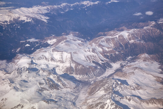 Fototapeta Caucasus mountains with snow peaks in aerial winter scene. Aerial view from plane.