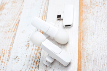 Two wireless microphones and a transmitter for your phone.