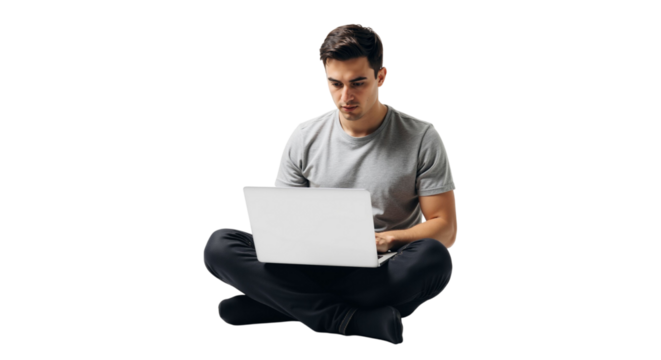 Focused young adult works from home using laptop with white background