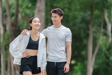 Obraz premium Young couple enjoying outdoor walk together, smiling
