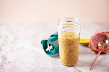 Tropical Mango and Dragonfruit  smoothie in a portable blender