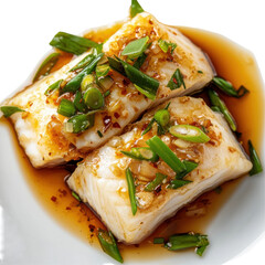 Steamed Fish Fillets with Ginger and Scallions in Soy Sauce on a White Plate on transparent background