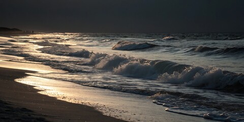 Stormy ocean waves crashing on a sandy beach at sunset.
