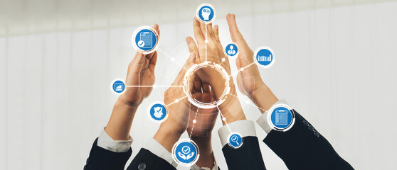 Hands raised together in celebration depict unity and cooperation. Digital icons represent innovation, growth, and success in a collaborative business environment. Amity