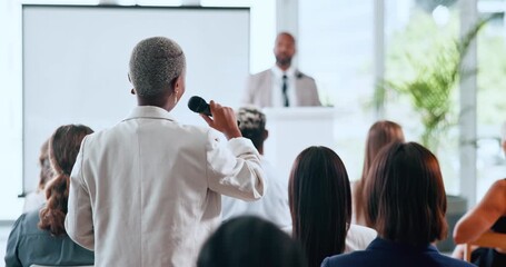Business woman, microphone and question in seminar for introduction, discussion and global convention. Training, speaker and back of person with audience at conference for engagement and b2b speech - Powered by Adobe