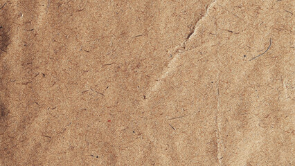 Old brown vintage paper texture background. Background of brown kraft paper or cardboard texture. Abstract pattern of beige rough carton, old paper sheet. 