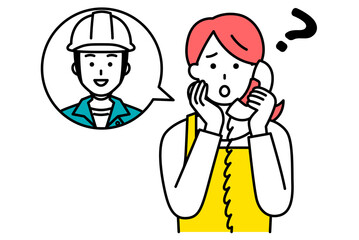 作業員に電話で相談する主婦