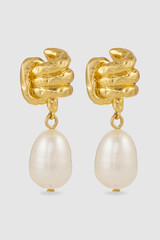 Elegant gold earrings with teardrop pearl pendants on isolated background