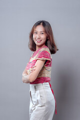 Confident Asian Woman Smiling with Arms Folded