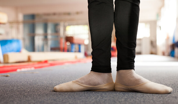 Close up of male gymnast legs practicing gymnastics in sport gym - Powered by Adobe
