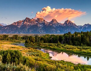 Fototapeta premium Majestic mountains reflected in serene river, under a stunning sunset