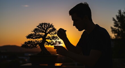 Silhouette of a dedicated individual meticulously tending to a beautiful bonsai tree during a serene sunset, embodying the tranquil art of miniature gardening and cultivation