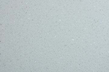 Mur blanc granuleux présentant une texture brute et uniforme, idéal comme fond minimaliste ou support visuel abstrait.