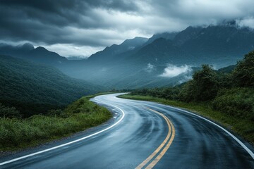 Fototapeta premium Road through mountains misty landscape