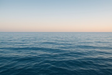 Obraz premium Tranquil seascape with calm ocean water and pastel sky horizon at sunrise evoking peace and minimal atmosphere of solitude and vastness concept. Ai generative