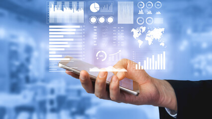 A professional hand holding a smartphone displays dynamic data visualizations and informative graphics, symbolizing modern technology in business analytics. Impute