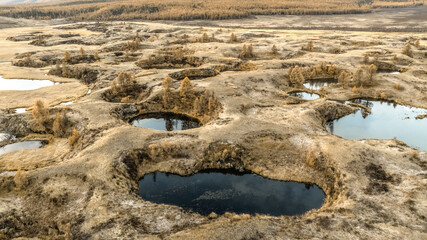 Craters filled with water, aerial view.