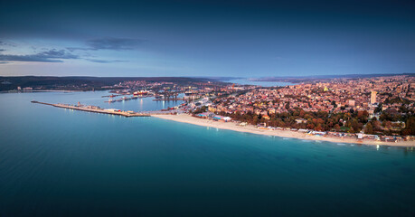 Scenic panoramic city view of Varna, Bulgaria cityscape, aerial drone view over the city skyline during dramatic sunrise