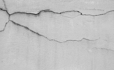 Crack wall texture background broken earthquake effect, whtie grey building cement damage pattern plaster grunge black line paint surface abstract, construction rough street concrete backdrop.