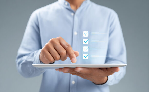 Focused businessman using tablet for data driven hr management and workforce planning. concept of efficient digital checklist and modern technology for successful project management