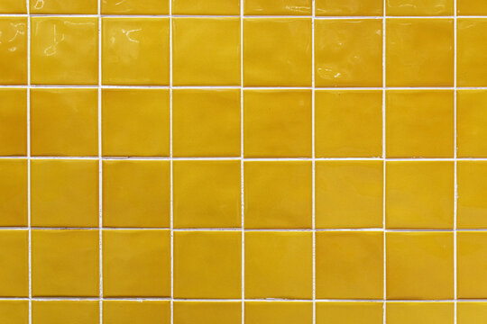 Yellow ceramic tile background. Old vintage ceramic tiles in green to decorate the kitchen or bathroom 