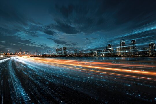 Night cityscape featuring streaks of light from traffic and city lights under a dramatic sky