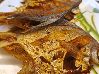 Golden Fried White Pomfret Fish Ready to Serve. The simple yet flavorful dish captures the essence of traditional Asian seafood cooking—crisp on the outside, tender inside, and perfect for a homemade 