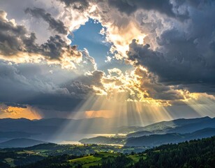 Sunbeams break through dramatic clouds over a lush valley and distant lake