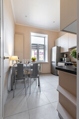 Cozy Bright Kitchen with Dining Area and Window Light