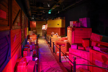 Gift boxes line the path leading into Santa’s wooden office.