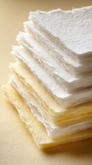 Stacked White And Cream Colored Papers