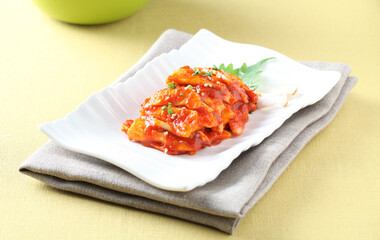 A traditional Korean pickle made with king oyster mushrooms and apples, combining chewy texture and sweet flavor. Crafted by Master Chef Hanshunseop. Photographed in Korea.