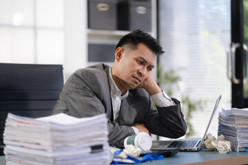 Male businessman are under stress from working for poor work.