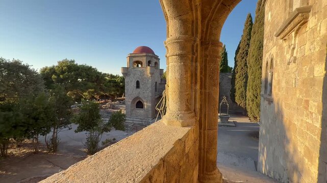 Visiting Saint Francis Monastery in Rodos Greece during golden hour revealing old architecture and landscape