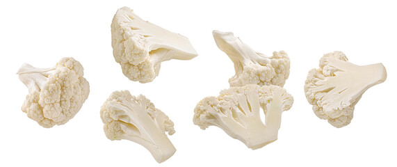 realistic photograph of a dense grouping of fresh, crisp white cauliflower florets and chunks, showcasing the texture and isolated cleanly on a solid black backdrop.