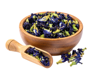 dried butterfly pea flowers placed in a small round wooden bowl isolated
