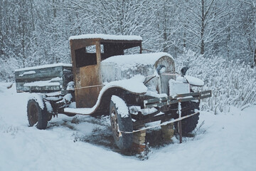 Military truck lorry against the backdrop of a winter forest