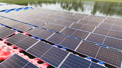 Drone view of Floating Solar Panel. Solar photovoltaic panel PV System in Industry lake water pond