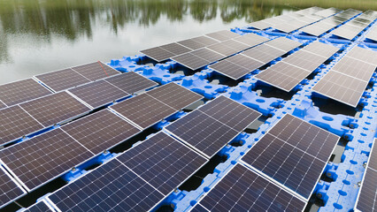 Drone view of Floating Solar Panel. Solar photovoltaic panel PV System in Industry lake water pond