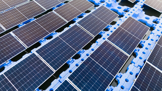 Drone view of Floating Solar Panel. Solar photovoltaic panel PV System in Industry lake water pond