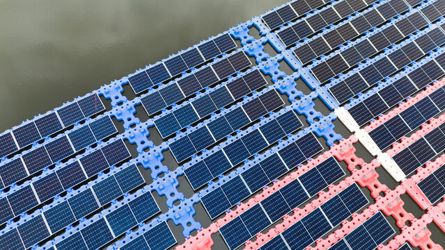 Drone view of Floating Solar Panel. Solar photovoltaic panel PV System in Industry lake water pond
