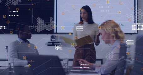 Woman wearing business attire presenting data visuals in conference room, with hexagonal overlay